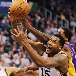 Utah Jazz forward Derrick Favors (15) battles Los Angeles Lakers forward Ed Davis (21) for the ball as the Jazz and the Lakers play Wednesday, Feb. 25, 2015, at EnergySolutions Arena in Salt Lake City.