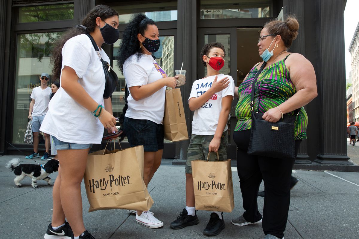 Tynisha Cruz, second from left, drove up from Charlotte with her children and mother-in-law to visit New York and go shopping, including at the Harry Potter store in Manhattan, July 15, 2021.