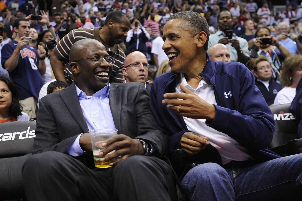 WASHINGTON, DC - JULY 16: U.S. President Barack Obama shares a laugh with former White House aide Reggie Love as they watch the US Senior Men's National Team and Brazil play during a pre-Olympic exhibition basketball game in 2012.