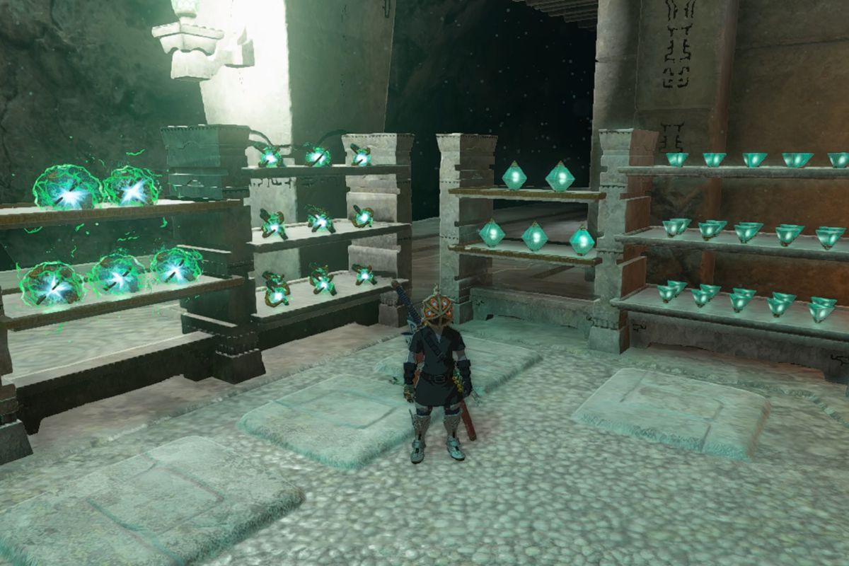Link stands in front of shelves at a forge construct, where crystallized charges and Zonai charges are lined up in The Legend of Zelda: Tears of the Kingdom