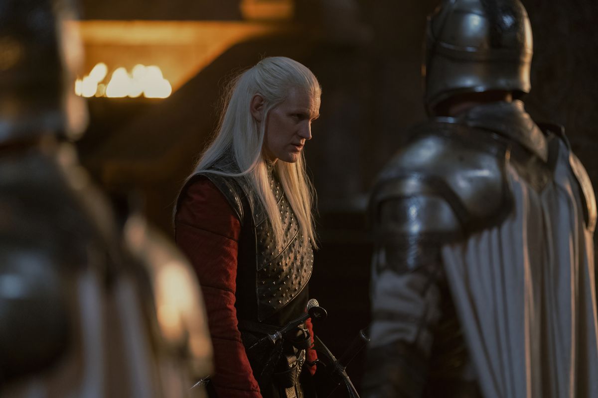 Matt Smith as Daemon Targaryen standing and looking fierce with guards in front of him
