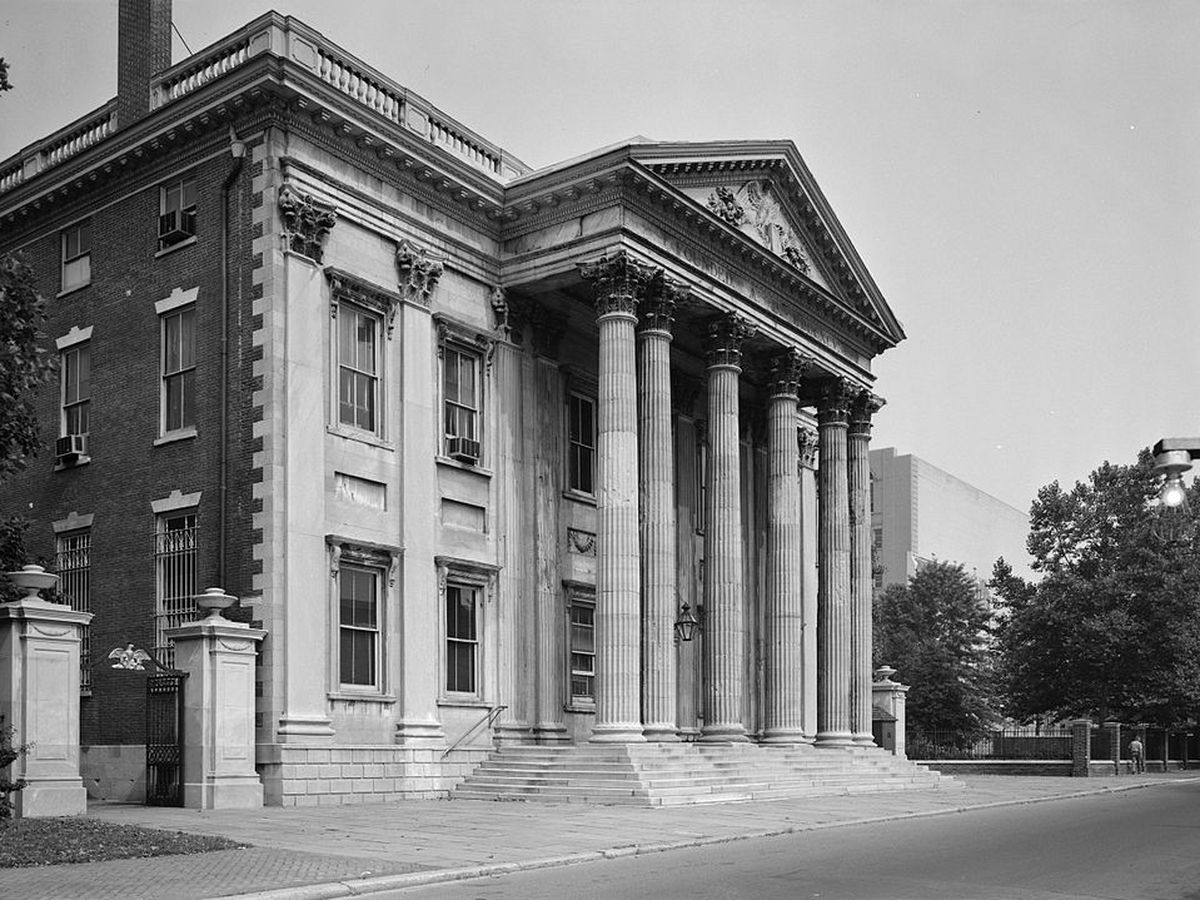A large house with columns on the facade.