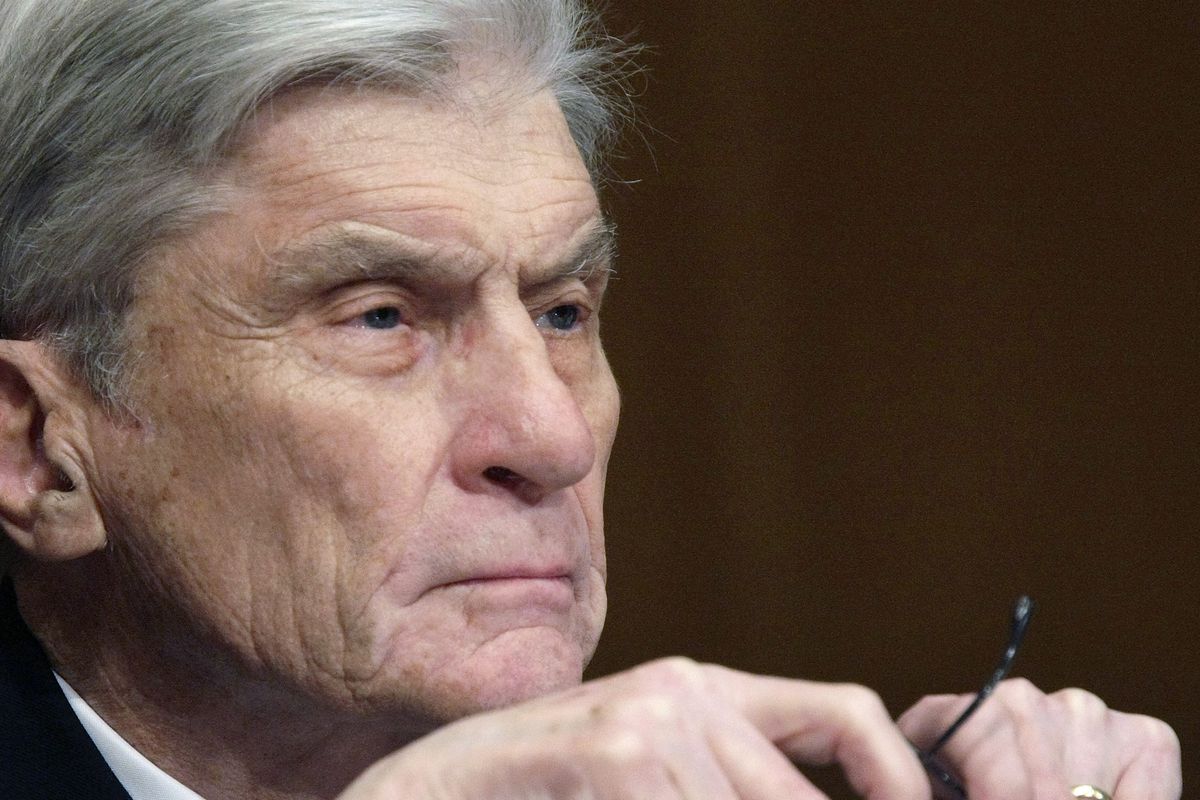 In this April 8, 2008 file photo, then Senate Armed Services Committee member Sen. John Warner, R-Va., listens to testimony on Capitol Hill in Washington. 