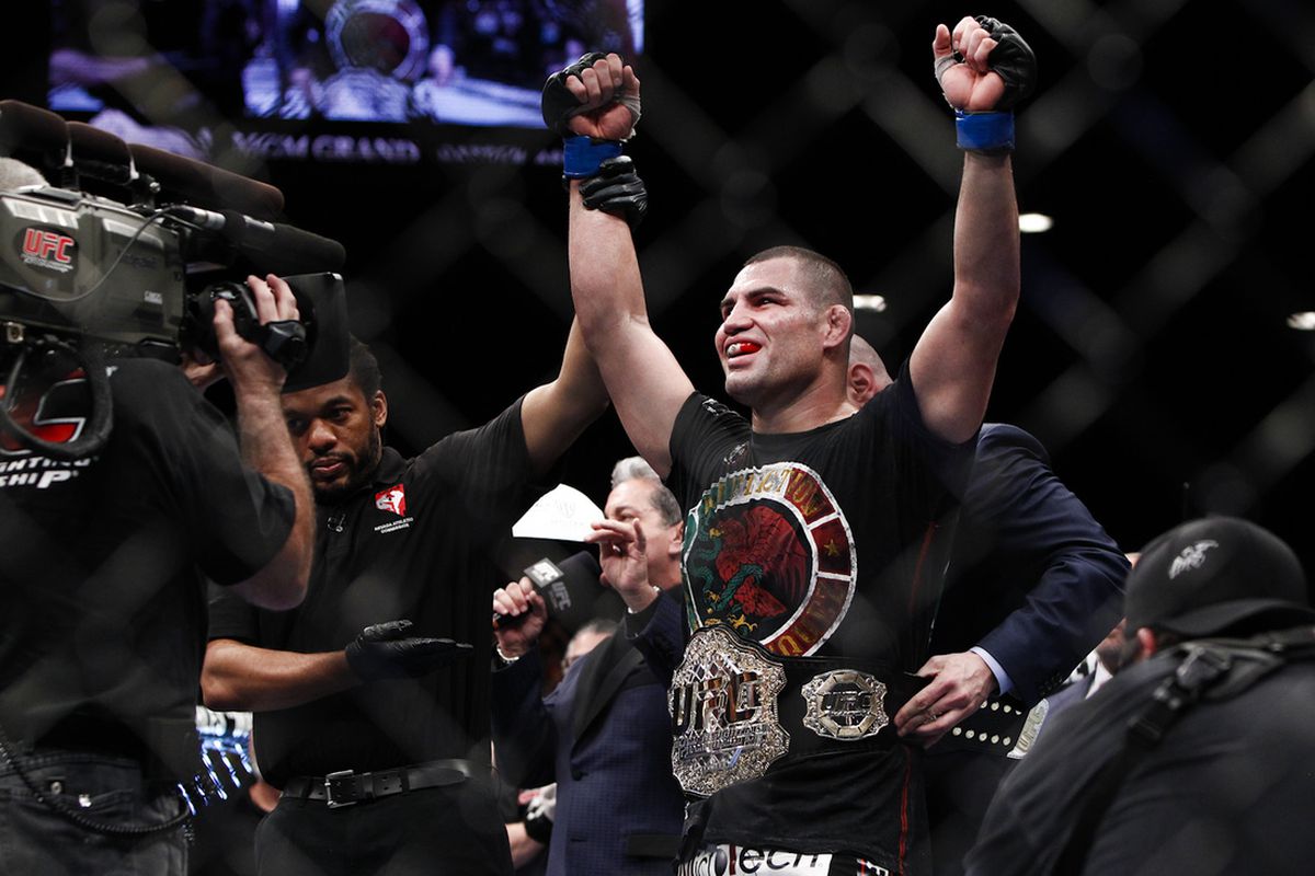 Cain Velasquez reclaims his UFC heavyweight title with a win over Junior dos Santos at UFC 155.