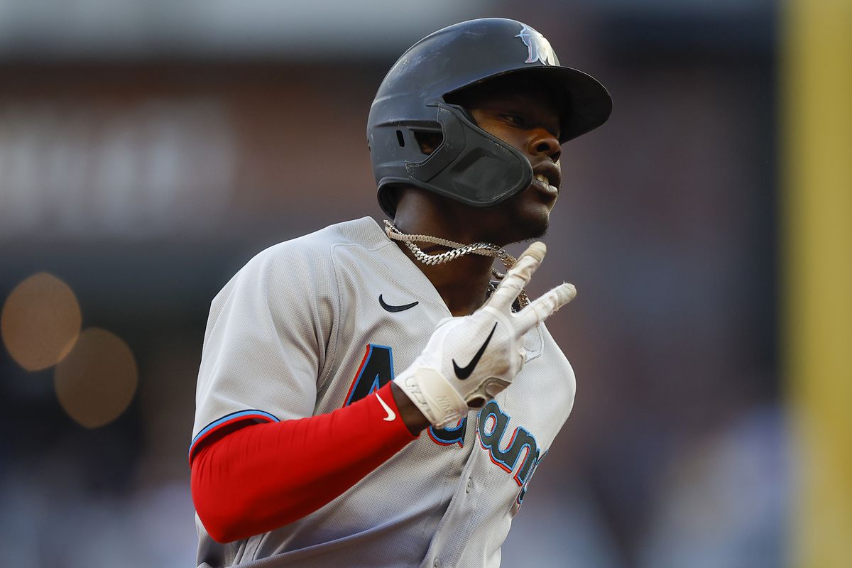 Jazz Chisholm Jr. #2 of the Miami Marlins reacts after hitting a lead off home run during the first inning of an MLB game against the Atlanta Braves at Truist Park