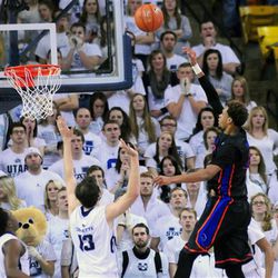 Boise State's Rob Heyer shoots over Utah State's David Collette (13) during an NCAA college basketball game, Tuesday, Feb. 3, 2015, in Logan, Utah. (AP Photo/Herald Journal, John Zsiray)