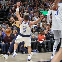 Utah Jazz guard Ricky Rubio (3) commits an offensive foul against Dallas Mavericks guard J.J. Barea (5) as the Utah Jazz host the Dallas Mavericks at Vivint Arena in Salt Lake on Monday, Oct. 30, 2017.