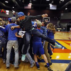 Panguitch Bobcats players and fans celebrate their win over the Piute Thunderbirds in the girls 1A basketball championship at the Sevier Valley Center in Richfield Saturday, Feb. 21, 2015. The Bobcats beat the Thunderbirds, 58-28.