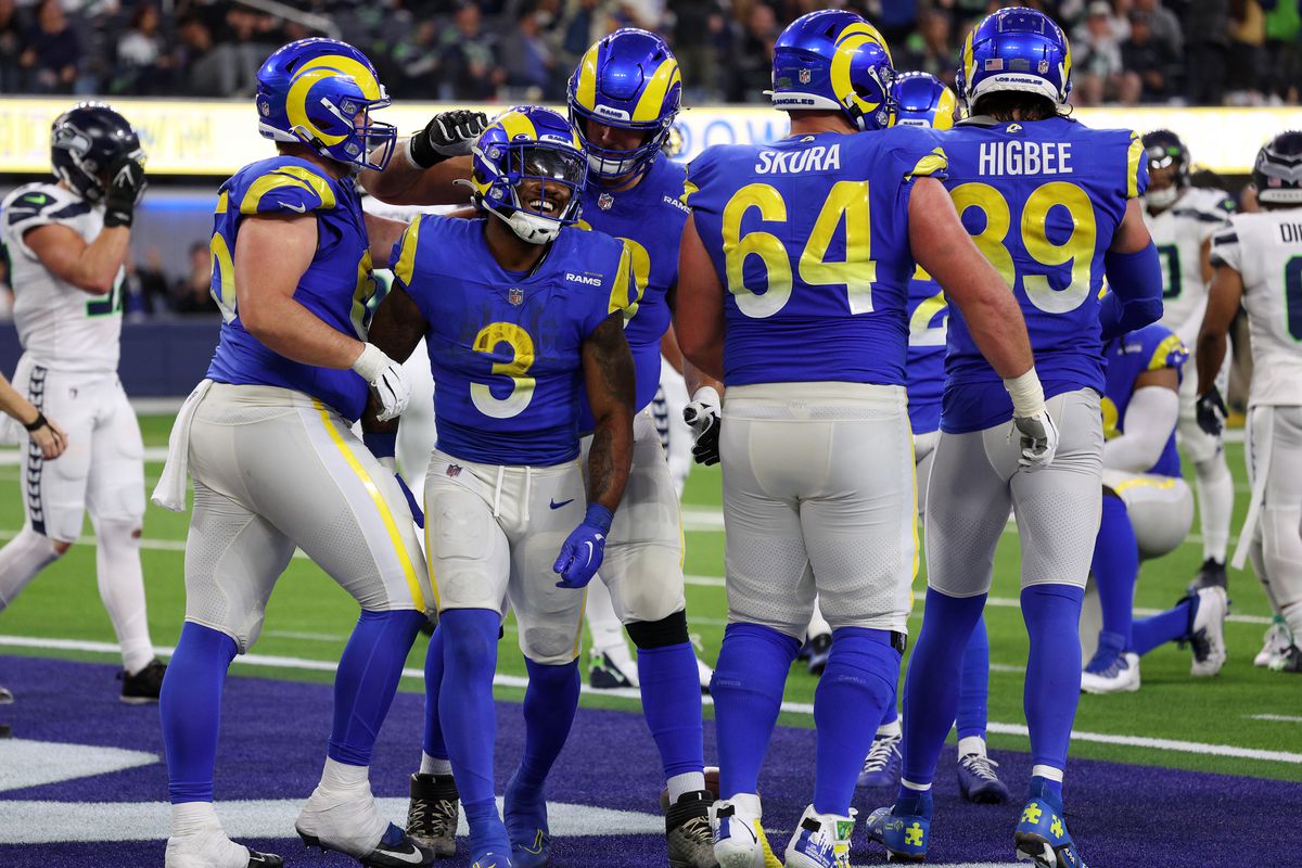Coleman Shelton #65 of the Los Angeles Rams and Rob Havenstein #79 celebrate alongside Cam Akers #3 after a touchdown in the fourth quarter of the game against the Seattle Seahawks at SoFi Stadium on December 04, 2022 in Inglewood, California.