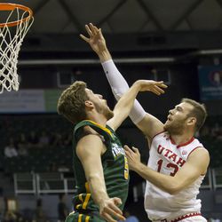 Utah forward David Collette (13) shoots over San Francisco center Jimbo Lull, left, during the first half of an NCAA college basketball game at the Diamond Head Classic, Thursday, Dec. 22, 2016, in Honolulu. (AP Photo/Eugene Tanner)