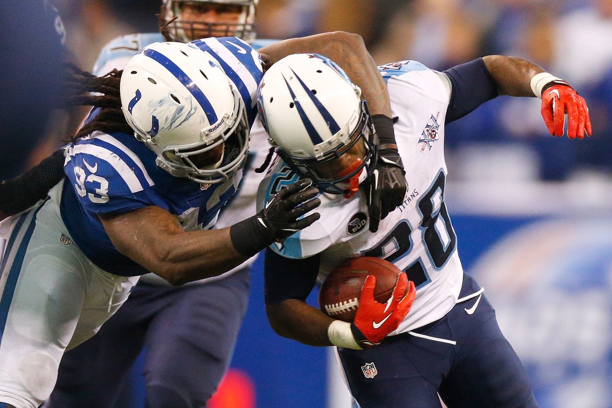 Tennessee Titans running back Chris Johnson is tackled by Indianapolis Colts linebacker Erik Walden 