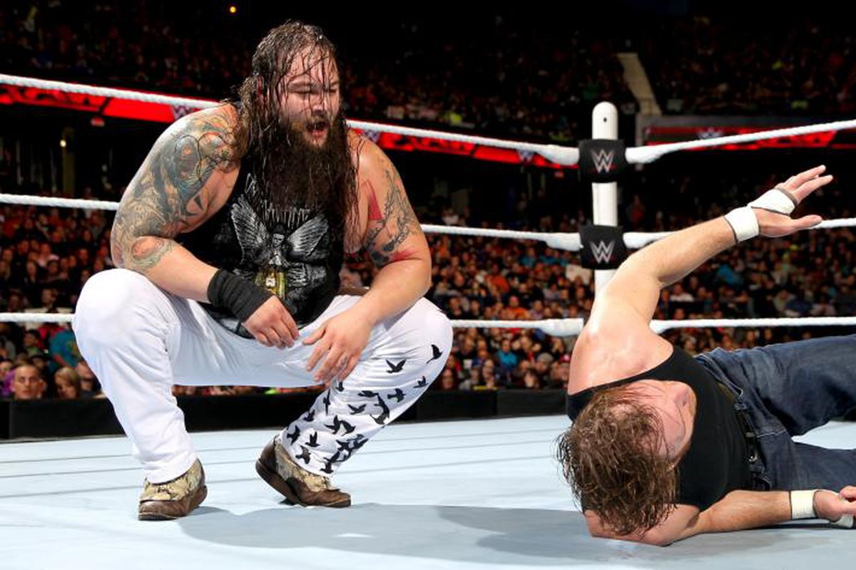 Bray Wyatt looks down at Dean Ambrose