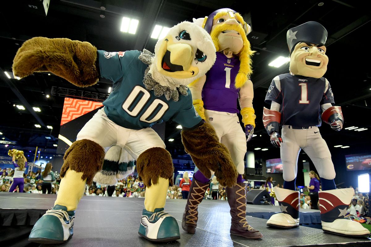 MINNEAPOLIS, MN - Mascots representing the Philadelphia Eagles and Minnesota Vikings take the stage before a music performance during the NFL Play 60 Kids Day at the Super Bowl Experience.  A specter haunts them, representing the only good AFC team - the 