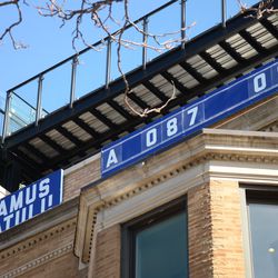 12:07 p.m. Some numbers, and a letter, appear to be missing from the "EAMUS CATULI" rooftop on Sheffield Avenue. They may have been blown off by the high winds on Friday -
