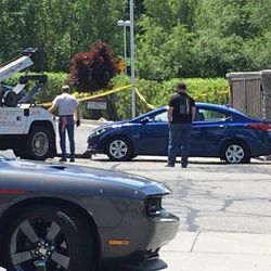 A 20-year-old man was found dead in the passenger seat of a car parked at a Cottonwood Heights credit union early Friday. Police said he was shot and the crime appears to have occurred at another location.