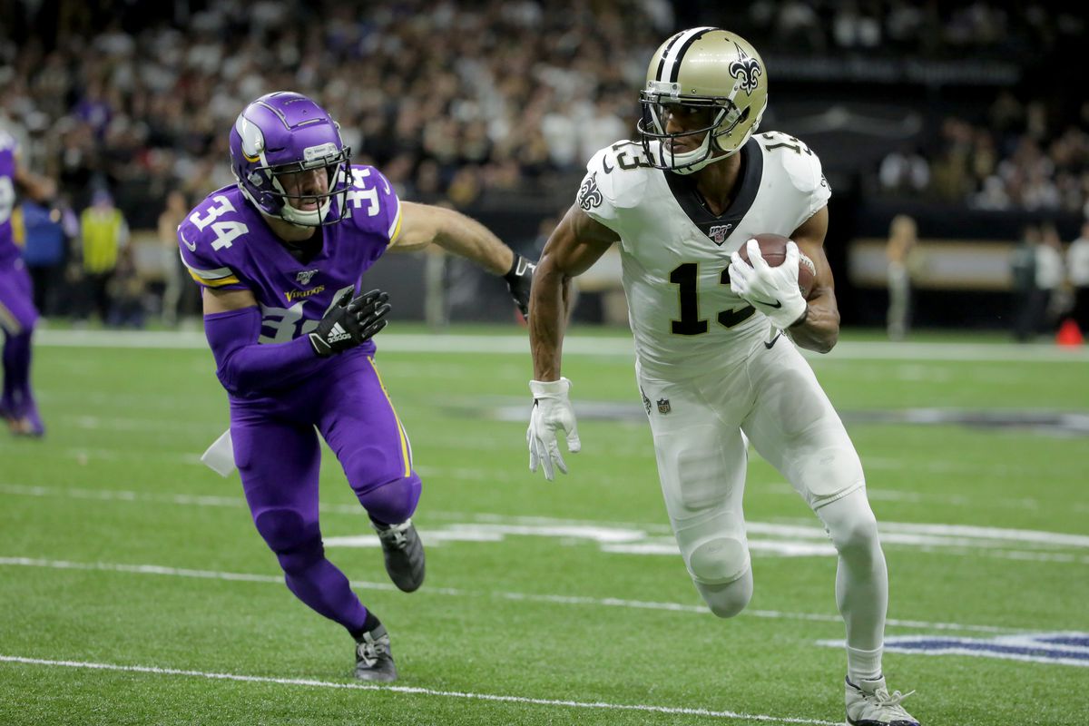 New Orleans Saints wide receiver Michael Thomas runs after a pass reception against Minnesota Vikings strong safety Andrew Sendejo during the first quarter of a NFC Wild Card playoff football game at the Mercedes-Benz Superdome.&nbsp;