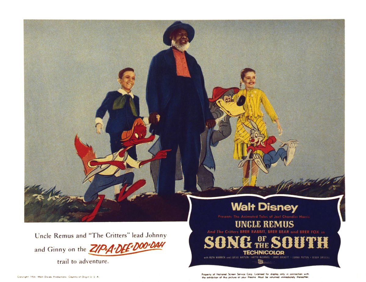 A 1946 lobby card for Song Of The South, with the movie’s human and cartoon cast walking along together above a caption that reads “Uncle Remus and ‘The Critters’ lead Johnny and Ginny on the Zip-a-dee-doo-dah trail to adventure.”