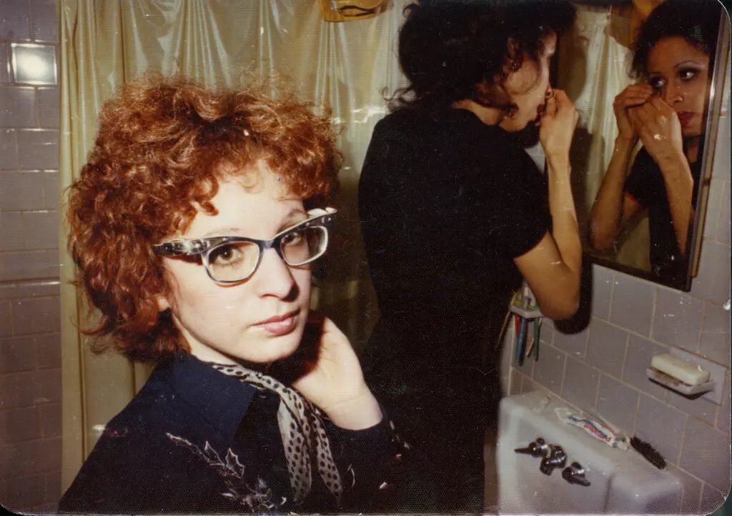 “Nan in the bathroom with roommate, Boston,” a photograph by Nan Goldin, featured in Laura Poitras’s new documentary