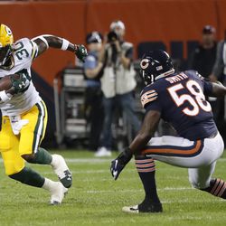 Green Bay Packers’ Jamaal Williams runs past Chicago Bears’ Roquan Smith during the first half of an NFL football game Thursday, Sept. 5, 2019, in Chicago.
