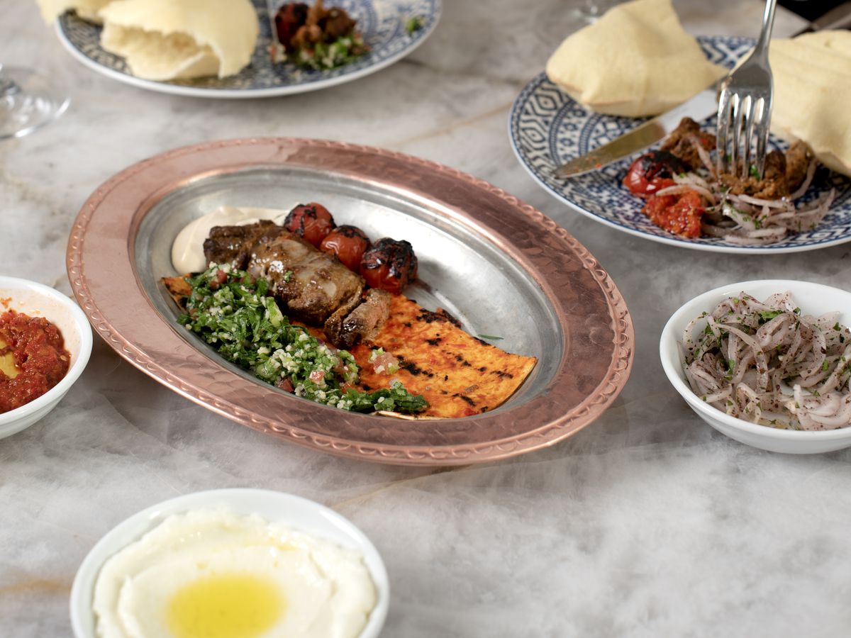 A collection of dishes from a Mediterranean restaurant. 