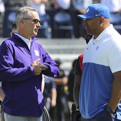 Washington Huskies coach Chris Petersen and Brigham Young Cougars head coach Kalani Sitake talks prior to the game in Provo on Saturday, Sept. 21, 2019.