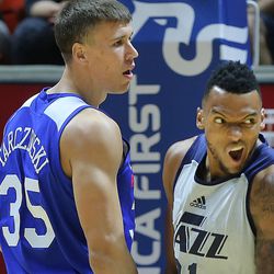 Utah Jazz forward Joel Bolomboy (21) reacts after an and-one on Philadelphia 76ers center Kaleb Tarczewski (35) as the Utah Jazz and the Philadelphia 76ers play in Summer League action in the Huntsman Center at the University of Utah in Salt Lake City on Wednesday, July 5, 2017.