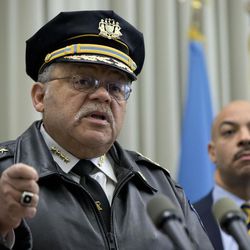Philadelphia Police Commissioner Charles Ramsey, left, speaks as District Attorney Seth Williams listens during a news conference Thursday, Feb. 5, 2015, in Philadelphia. Two Philadelphia police officers face brutality charges after prosecutors say they knocked a man off a scooter and beat him so severely another officer thought the bloodied man had been shot. 