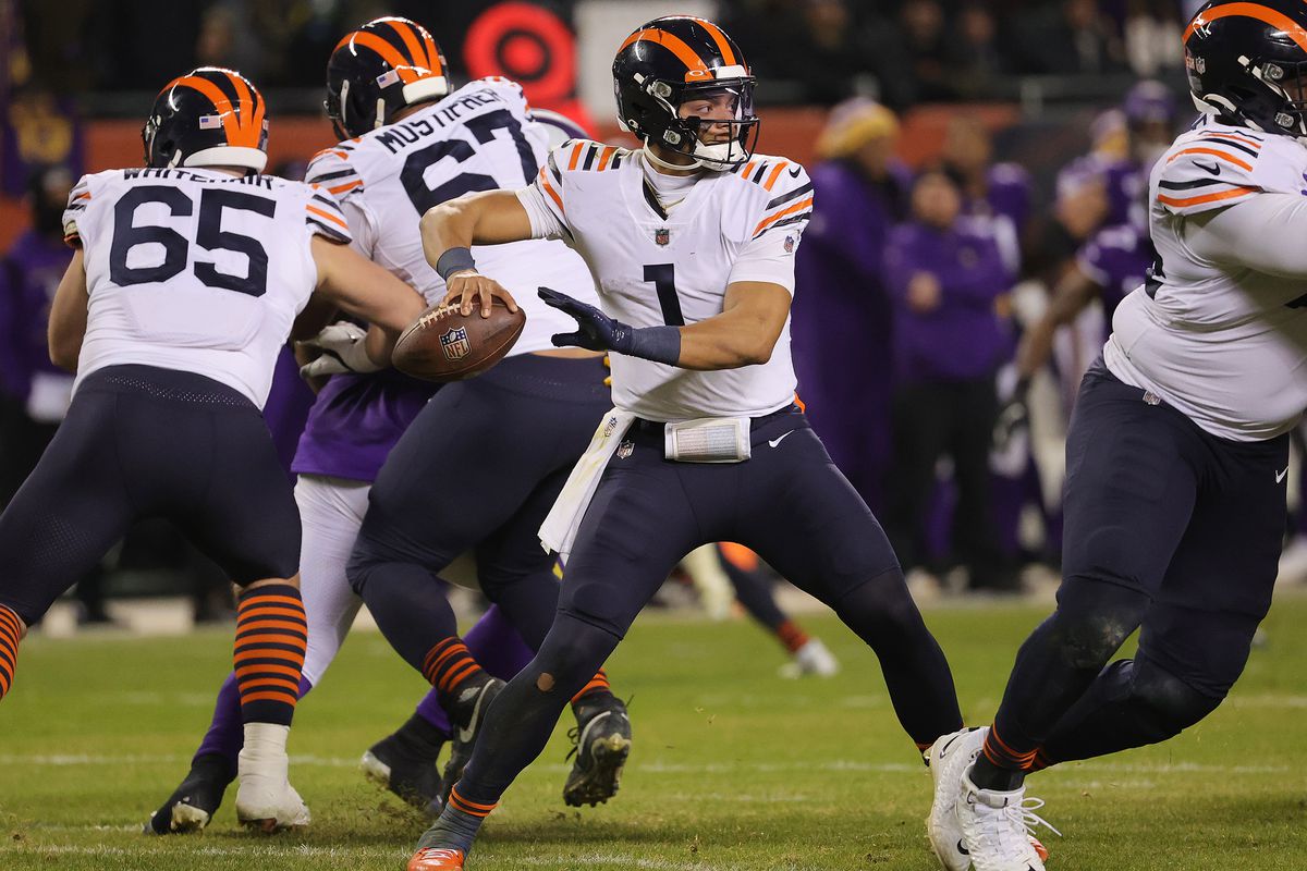 Justin Fields #1 of the Chicago Bears looks to pass against the Minnesota Vikings during the fourth quarter at Soldier Field on December 20, 2021 in Chicago, Illinois.