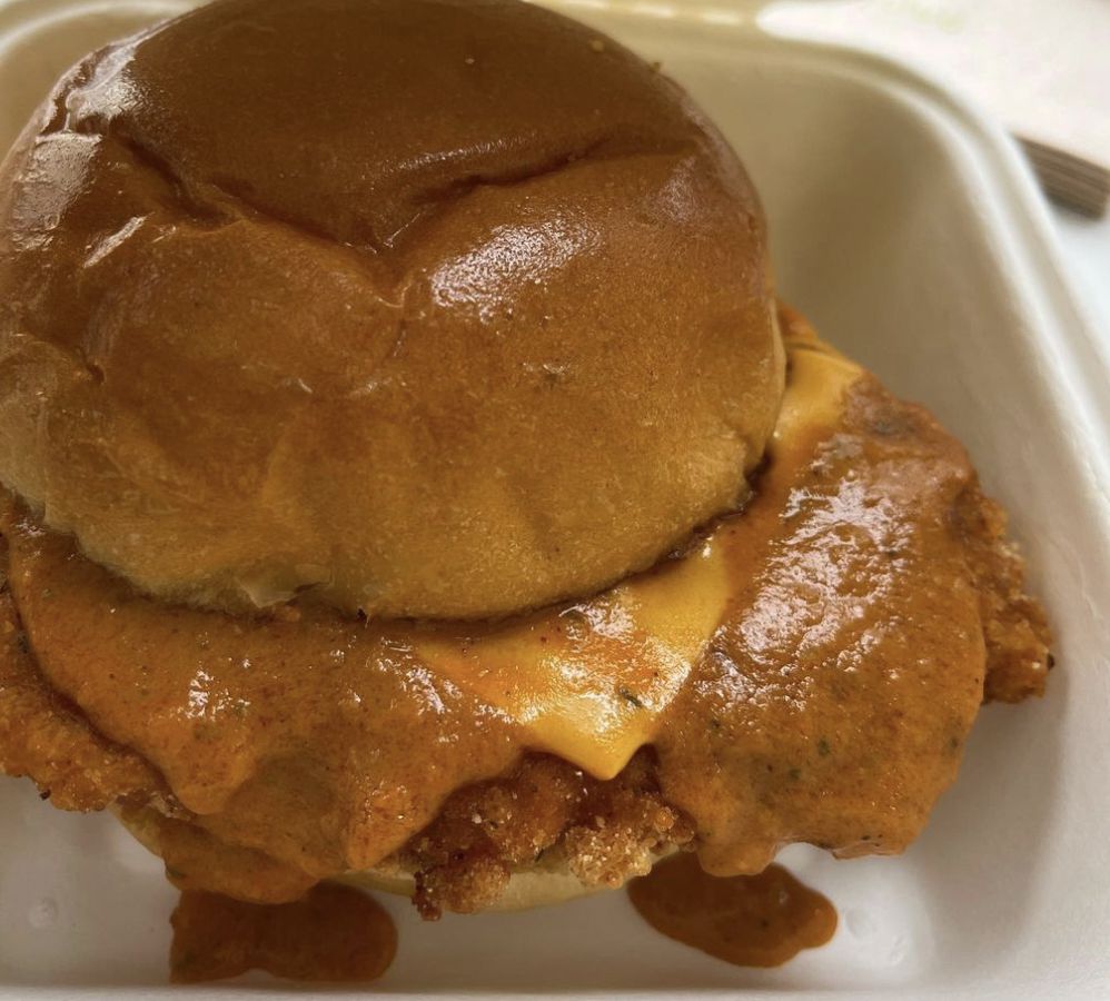 A fried chicken sandwich with cheese.