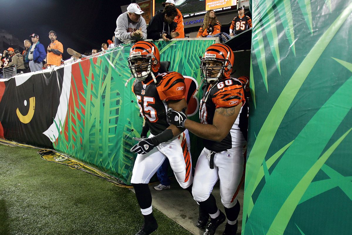 Marcus Wilkins #55 and Langston Moore #60 of the Cincinnati Bengals runs onto the field after halftime during Monday Night Football against the Denver Broncos on October 25, 2004 at Paul Brown Stadium in Cincinnati, Ohio.