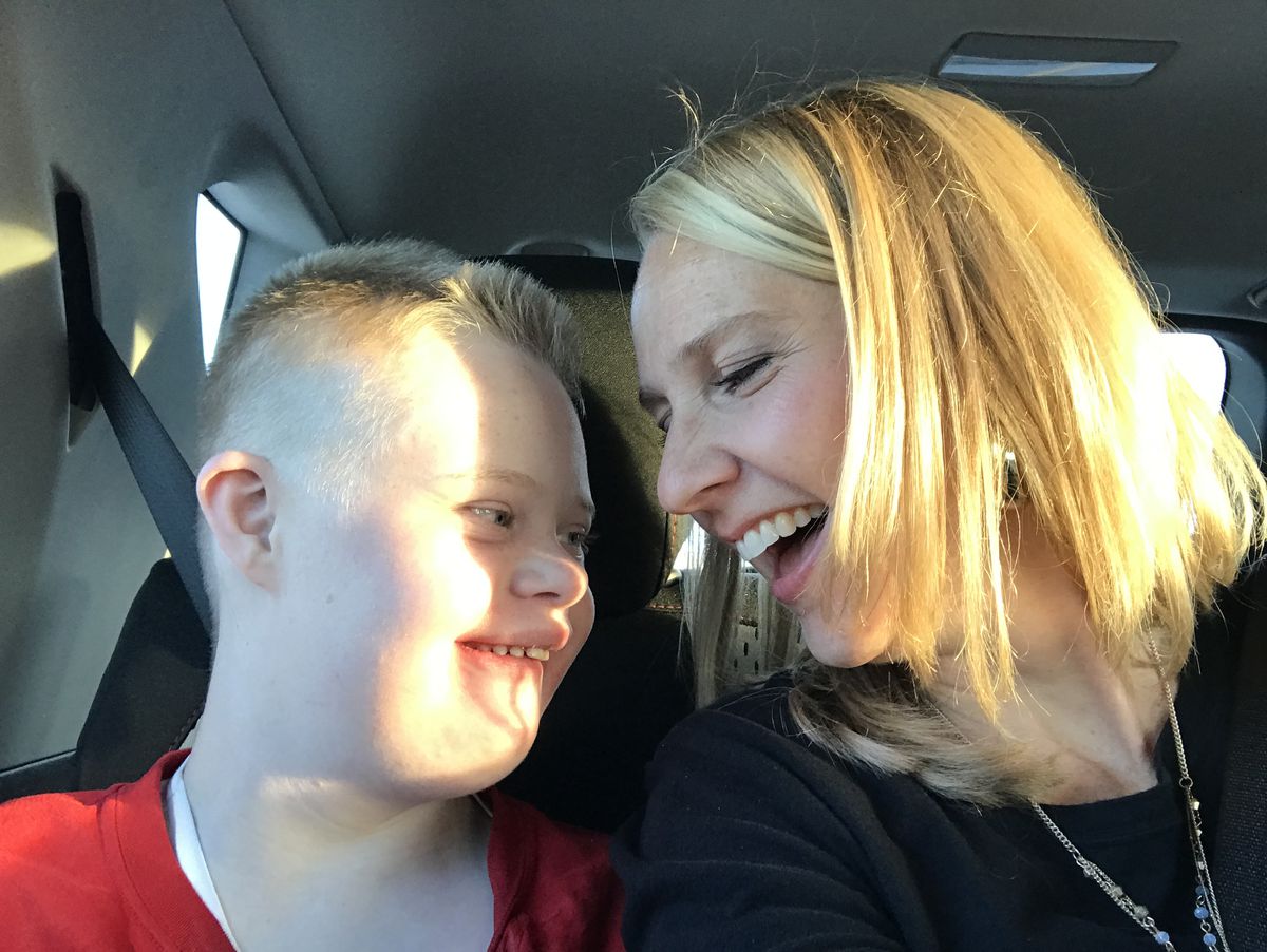 A tender moment with Emily Craynor and her son Mikey, who is 16. He has Down syndrome and is mostly nonverbal.