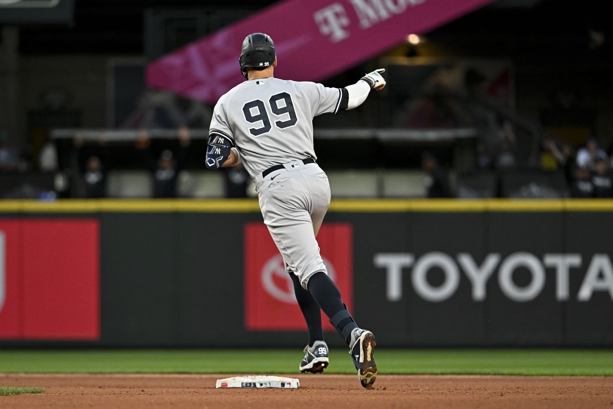 Aaron Judge of the New York Yankees gestures after hitting one-run home run during the seventh inning against the Seattle Mariners at T-Mobile Park on May 30, 2023 in Seattle, Washington.