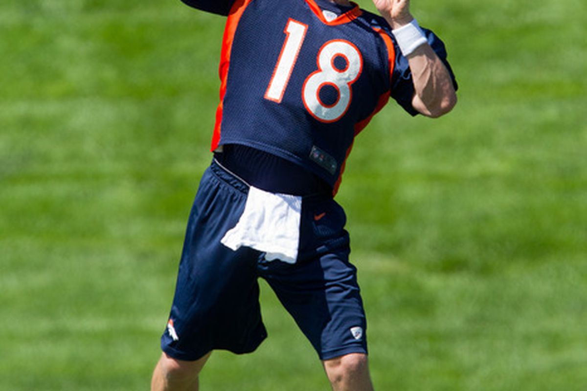 ENGLEWOOD, CO - MAY 21:  Peyton Manning #18 of the Denver Broncos throws during organized team activities at Dove Valley on May 21, 2012 in Englewood, Colorado. (Photo by Justin Edmonds/Getty Images)