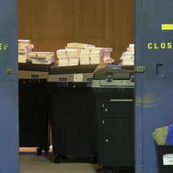 Ballots are stacked up behind a door as a statewide presidential election recount begins Thursday, Dec. 1, 2016, in Milwaukee. The first candidate-driven statewide recount of a presidential election in 16 years began Thursday in Wisconsin, a state that Donald Trump won by less than a percentage point over Hillary Clinton after polls long predicted a Clinton victory. 