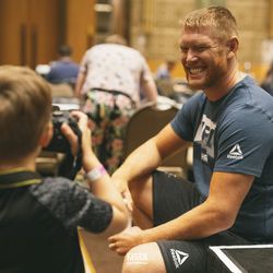 Sam Alvey’s son takes a photo of his Dad at UFC 234 media day.