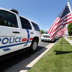 UTA police vehicles are parked at funeral services for Kay Ricks outside an LDS chapel in American Fork, Saturday, May 28, 2016. Ricks was a UTA employee who vanished while on the job and was found dead in Wyoming on May 17.