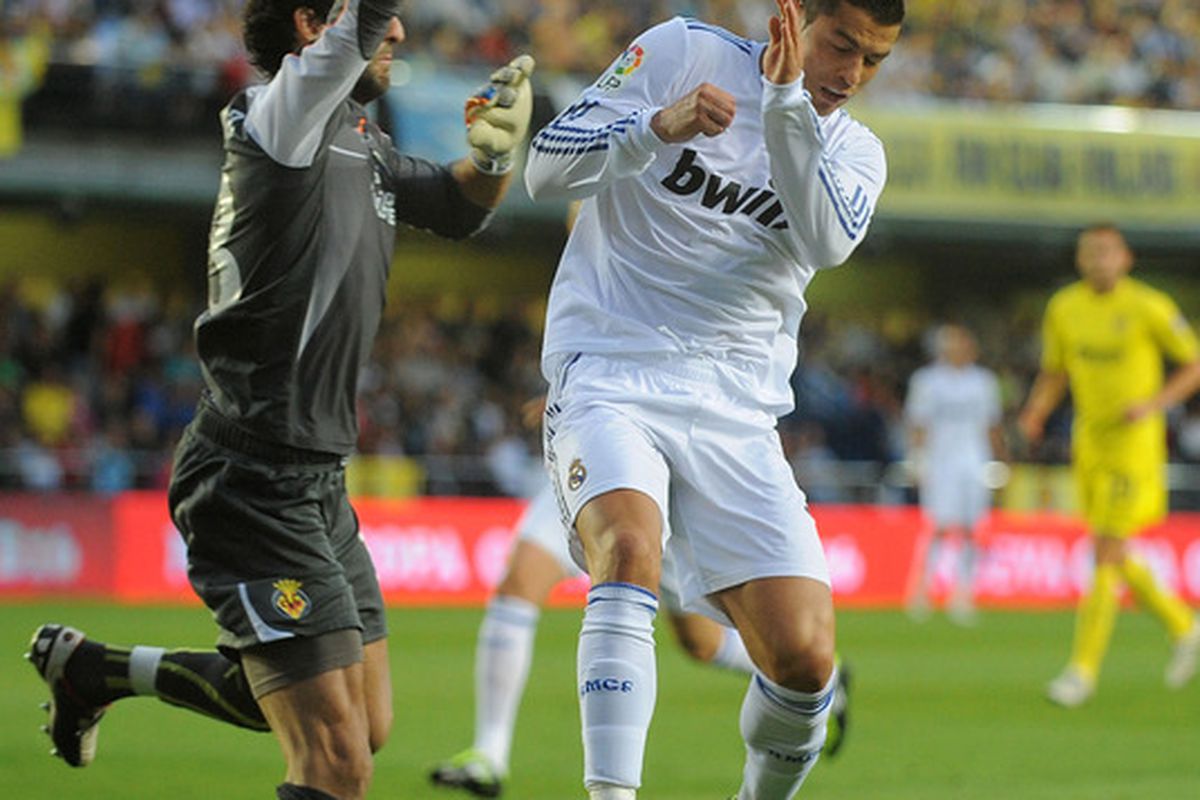 Uphill Battle: Lopez trying to keep Cristiano Ronaldo from scoring.