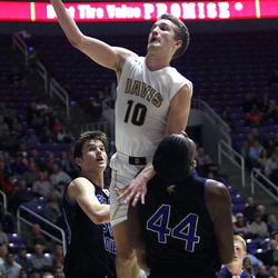 Davis' Jesse Wade (10) shoots as Davis plays Pleasant Grove in the 5A boys basketball quarterfinals at the Dee Events Center in Ogden Wednesday, Feb. 25, 2015.