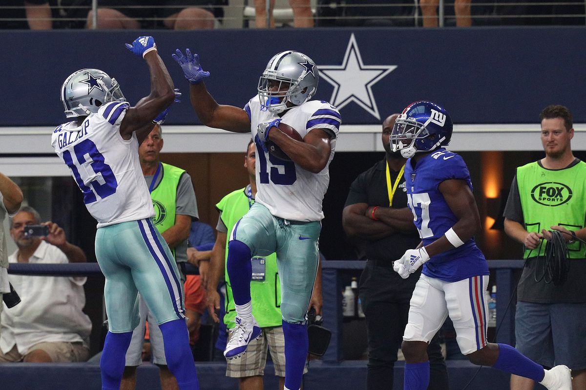 Michael Gallup and Amari Cooper of the Dallas Cowboys celebrate a second quarter touchdown against the New York Giants at AT&amp;T Stadium on September 08, 2019 in Arlington, Texas.