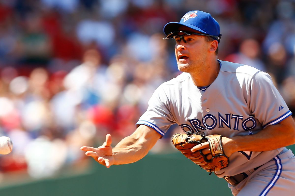 BOSTON, MA - JULY 22: Omar Vizquel #17 of the Toronto Blue Jays flips the ball to first base for an out against the Boston Red Sox during the game on July 22, 2012 at Fenway Park in Boston, Massachusetts.  (Photo by Jared Wickerham/Getty Images)