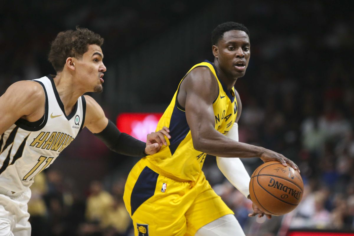 Indiana Pacers guard Darren Collison drives on Atlanta Hawks guard Trae Young in the first quarter at State Farm Arena.