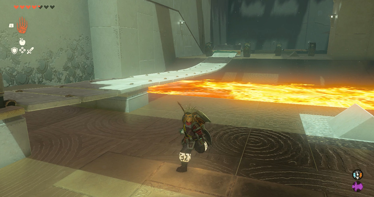 A wheeled device pulls a bridge over a pit of fire in The Legend of Zelda: Tears of the Kingdom’s Marakuguc Shrine.