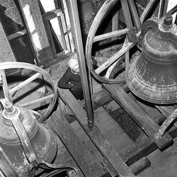 Sexton Pieter Smit examines "Mary" and "Joseph," bells in the tower of the Cathedral of the Madeleine, 331 E. South Temple, Dec. 10, 1963. The wooden wheels turn the bells.