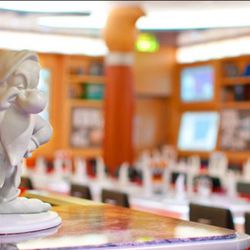 Dine under the watchful eye of a grumpy dwarf at Animator's Palate.<br /><br />Photo: Disney Cruise Lines