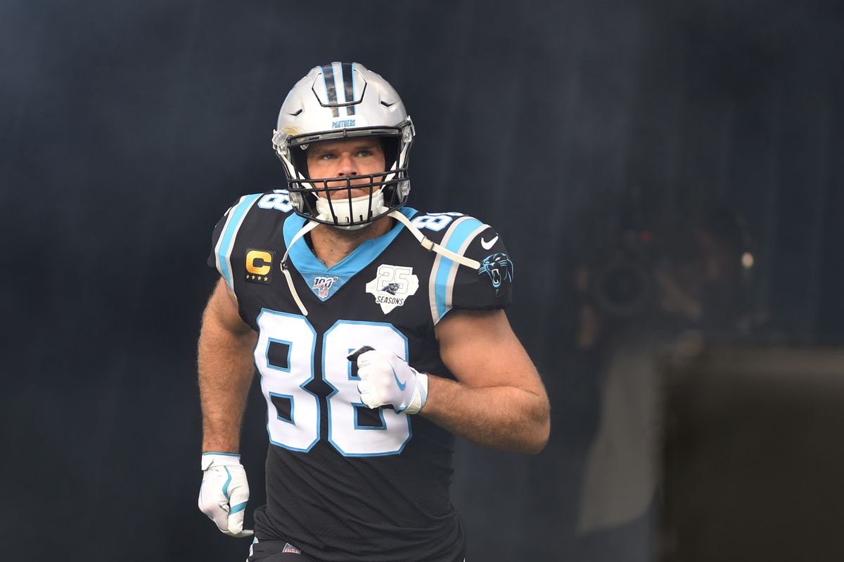 Carolina Panthers tight end Greg Olsen runs on to the field before a game at Bank of America Stadium.