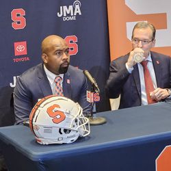 Brown listens to a question during his introductory press conference.