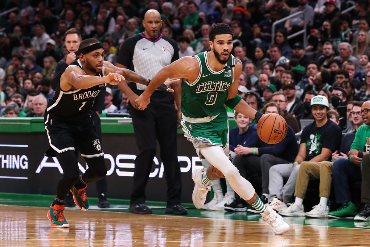 Boston Celtics forward Jayson Tatum (0) dribbles down the court during the second half against the Brooklyn Nets at TD Garden.