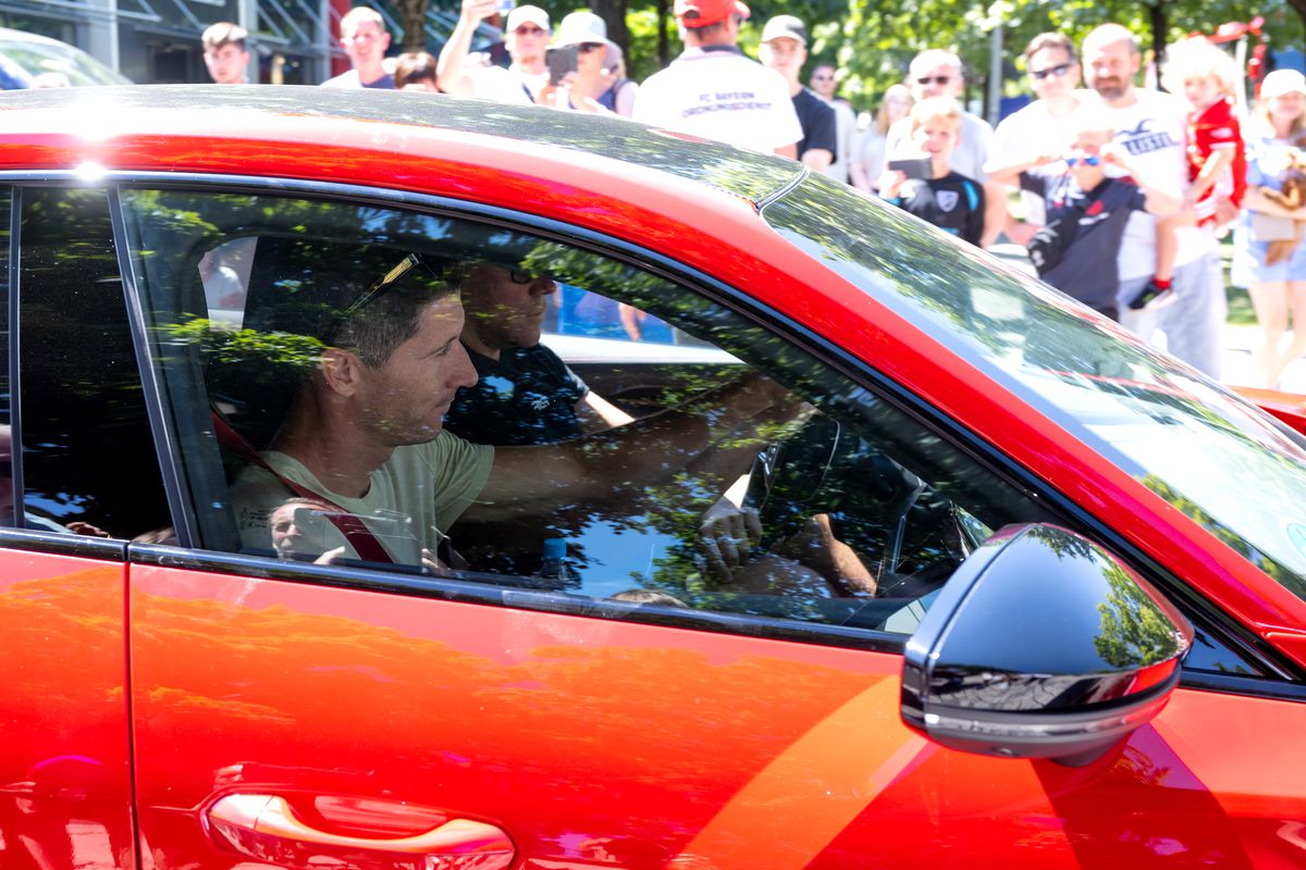 Robert Lewandowski in his red sports car departing Bayern facilities on July 16 after his final training session