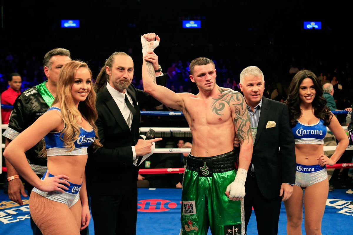 Joe Smith, Jr. celebrates defeating Will Rosinsky during their Light Heavyweight bout on December 5, 2015 in the Brooklyn borough of New York City.