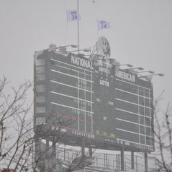 Scoreboard, with Ernie Banks flags still flying at half staff